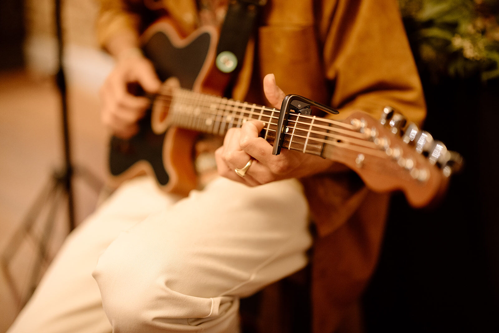 Mitch playing acoustic guitar